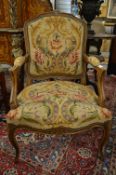 A French beech framed and needlework upholstered fauteuil.
