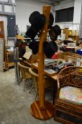 A large naturalistic carved wood hat stand.
