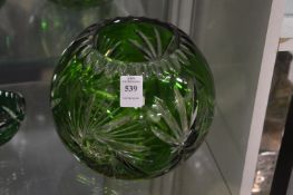 A Bohemian cut glass and green tinted globular glass vase.