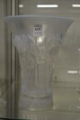 A good large Lalique style opalescent trumpet shaped glass vase moulded with flowers.