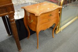 A French serpentine fronted two drawer chest.