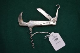 A silver mounted multi-tool with leather case.