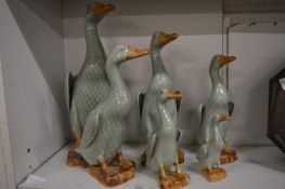 Graduated set of six Chinese celedon glazed ducks.