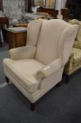 A Georgian style wing armchair.