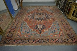 A good Persian carpet, early 20th century, red and blue ground with stylised decoration, 336cm x
