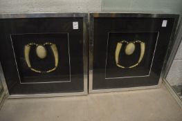 A pair of Eastern horn bead necklaces, framed and glazed.