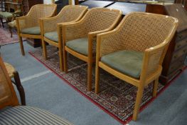 A set of four modern bergere style chairs.