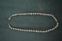 Decorative malachite bead necklace.