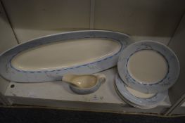A Clarice Cliff Bizarre salmon platter designed by William Robins, the pale blue border decorated