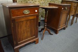 A pair of mahogany pedestal cupboards.