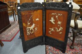Chinese folding screen with mother of pearl and bone inlaid panels.