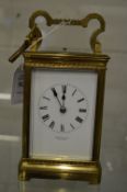A brass striking carriage clock.