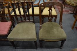 Two mahogany dining chairs.