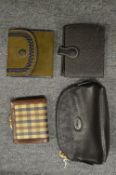 A ladies Longchamp black leather purse and three other purses.