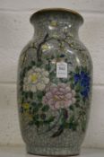 A Chinese floral decorated crackle glazed vase (faults).