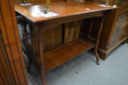 A Victorian walnut two-tier occasional table.