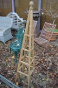 A wooden plant climbing obelisk.