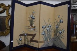 A Chinese decoratively painted folding screen.