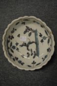 An 18th century tin glazed bowl together with a tin glaze dish decorated with a bird (both with