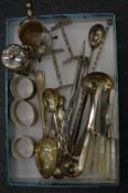 A quantity of silver items to include a pair of knife rests, napkin rings, cream jug etc.