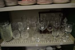 A quantity of glassware to include decanters, jugs, tantalus with mixed decanters and other items.