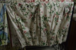 A pair of floral curtains, lined approx size 130cm wide x 156cm long.