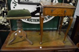 Revolving music seat and a small walnut table.