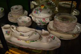 A quantity of French floral decorated pottery dinner ware.