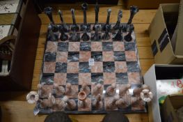 Marble chess set and matching chess pieces.