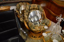 A pair of bamboo framed conservatory swivel armchairs.