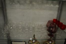 A quantity of assorted glassware to include a set of six champagne glasses with matching liqueur