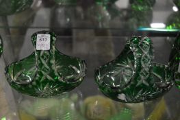 A pair of Bohemian cut glass and green tinted small flower baskets.
