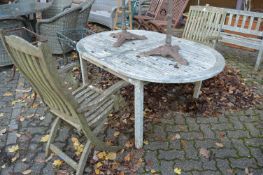 A hardwood garden table and two chairs.