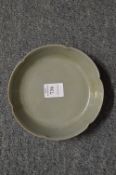A small Chinese celadon glazed dish.