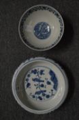 A Chinese blue and white circular bowl painted with birds on a branch together with another blue and