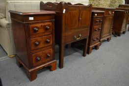 A pair of mahogany three drawer pedestal chests.