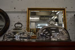 Two plated meat domes.