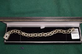 A boxed chain link bracelet.