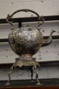 A Victorian plated kettle on stand (lacking burner).