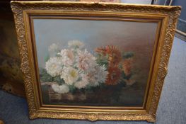 A still life of flowers in a wicker basket, oil on canvas, in a decorative gilt frame and three