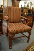 A pair of Georgian style carved mahogany framed open armchairs.