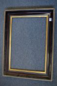 A moulded frame, rebate size 40.5cm x 61cm.
