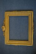 19th century gilt composition frame of with a central decorative cartouche, rebate size 37cm x 46.