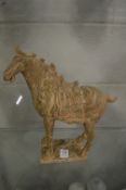 A Tang style terracotta horse with agate glazed decoration.