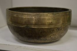 An Eastern bronze singing bowl.