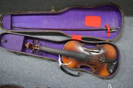 A cased violin.
