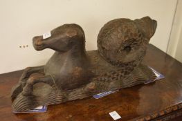 A carved wood hippocamp.