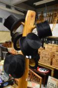Six old top hats.