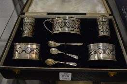 A cased silver cruet set.