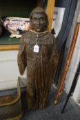 A large early 16th century carved wood figure of a saint.